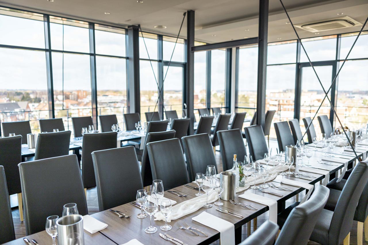 Elegant dining room with panoramic windows and city views
